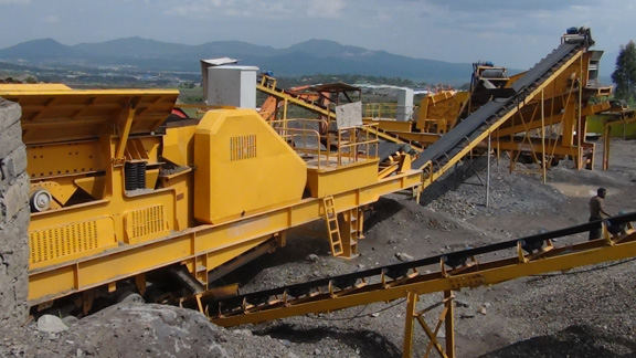 mobile crusher pictured at a granite crushing plant