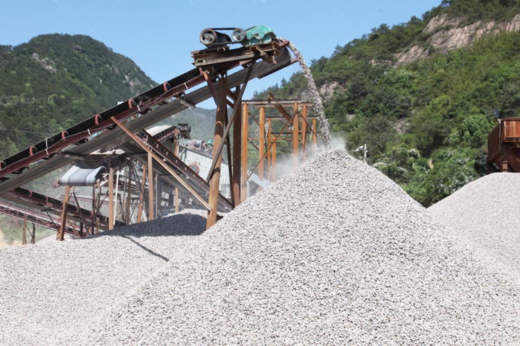 Large stones are crushed into small pieces by a crusher machine